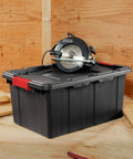Heavy Duty Plastic Storage Totes With Secure Snap Lids For Garage Shed Organization 15 Gallon 18 Pack with circular saw on top.