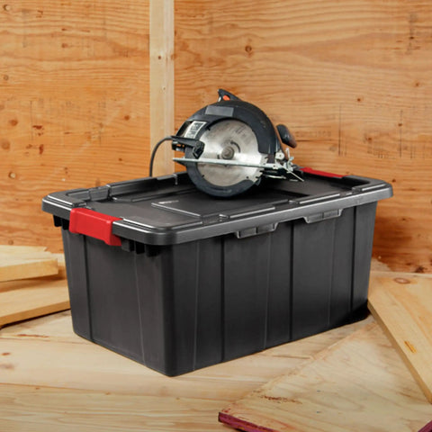 Heavy Duty Plastic Storage Totes With Secure Snap Lids For Garage Shed Organization 15 Gallon 18 Pack with circular saw on top.