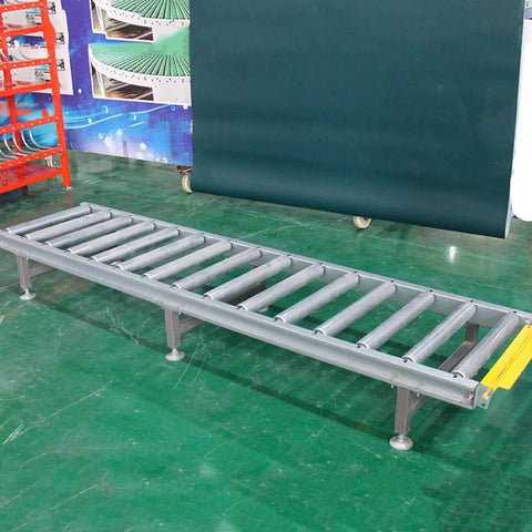 Super Heavy Duty Modular Conveyor Rollers And Connectable Discharge Chutes With Smooth Metal Roller Slide Kit For No Sweat Warehouse Dumping And Quick Truck Bed Unloading Rock Solid 5 Piece Pack Silver - metal conveyor rollers on a green floor.