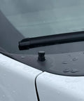 Close-up of Antenna Delete Cap For Ford F-150, SVT Raptor, And F-150 Lightning EV with rubber seal, carwash ready on vehicle.