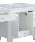 Top Shelf Carrara White Marble Bathroom Vanity With A Sleek Single Sink Setup And Rock Solid Wood Cabinet Featuring Brushed Nickel Knobs For That Go To 67 Inch Clean Slick Vibe, showing storage drawers and marble countertop detail.