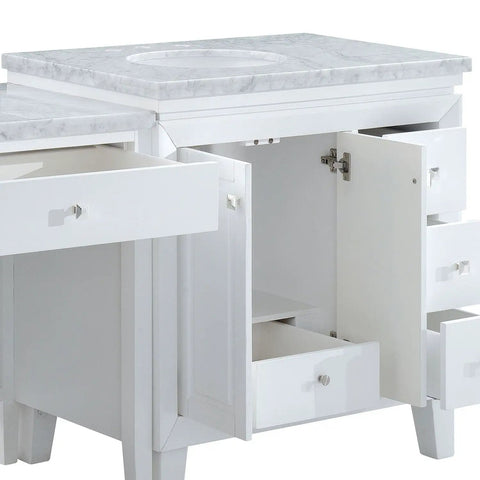 Top Shelf Carrara White Marble Bathroom Vanity With A Sleek Single Sink Setup And Rock Solid Wood Cabinet Featuring Brushed Nickel Knobs For That Go To 67 Inch Clean Slick Vibe, showing storage drawers and marble countertop detail.