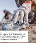 Gloved hand picking up plastic bottle, emphasizing environmental efforts related to Precision Vacuum Sealer Bags Pre Cut 8.6 By 11.8 Clear Easy Tear Tops Pack Of 50 For Quick Hassle Free Food Sealing And Fresh Storage Ideal For Meal Prep Freezer Safe And Fridge Organization.