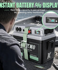 Man monitoring instant battery display on Smart Marine Battery Box 12V 24V Power Center With USB C And QC3.0 Quick Charge Port for boat.