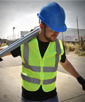 Worker wearing High Viz ANSI Class 2 Safety Vest No Pocket Neon Yellow Large For Men And Women Reflective Polyester Vest.