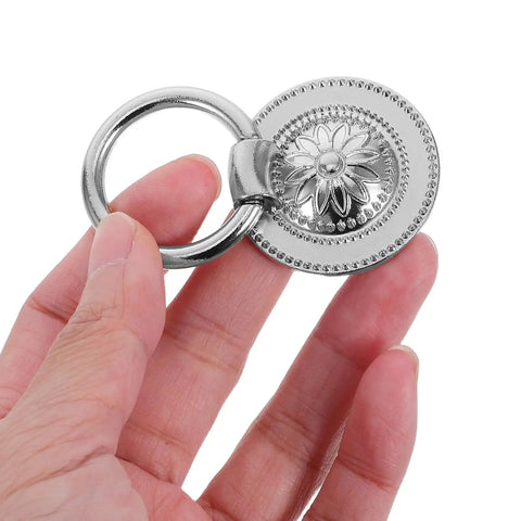 Hand holding Vintage Flower Drawer Pulls, 4-Piece Set, 36mm Antique White Nickel Finish, European Style Metal Cabinet Handles.