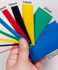 Assorted Heat Shrink Tubing Kit 410 Pieces With Five Colors And Ten Sizes for Wires, shown in hand for scale.