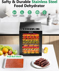 Food Dehydrator For Jerky And More With 12 Stainless Steel Trays displaying assorted fruits and meats on kitchen counter