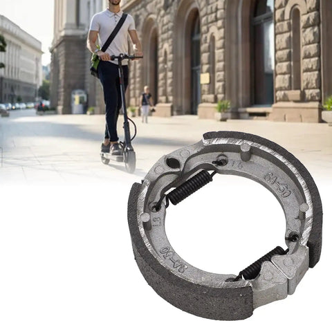 Electric Scooter Front Drum Brake Pad Shoe Replacement Part Built Tough From Lightweight Metal For Smooth Stops And Long Lasting Performance Easy Install Compatible With Most 8 And 9 Inch Models shown with commuter.