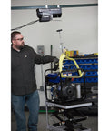 Strongway 1100 Lb Electric Cable Hoist With 2200 Lb Double Line Capacity For Garage Use features overhead lifting of an engine.