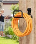 Heavy Duty Garden Hose Holder Wall Mount Built Tough Steel Hose Hanger with orange hose on wooden wall outside