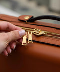 Gold Zipper Pull Replacement Set Pro Grade Four Metal Zipper Handles For Luggage Bags Backpacks shown on brown luggage