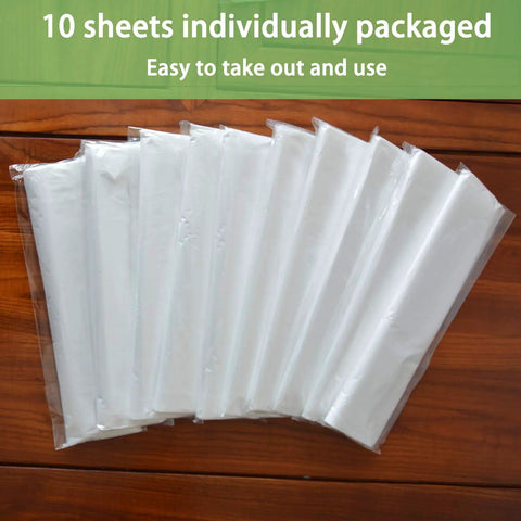 10 individually packaged sheets of 9x12 Feet Disposable Painter Drop Cloths With Gloves, Waterproof Anti Dust Clear Tarp displayed on wood.