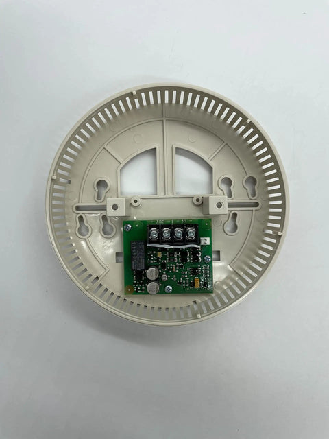 Indoor Fire Alarm Sounder And Strobe Light With Straight Up Reliable Alert Signals For Commercial Buildings Offering A No Brainer Wall Mount Setup And Top Shelf Heavy Duty Design, showing a beige plastic housing with internal circuitry.