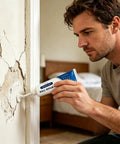 Man applying Quick Dry Wall Repair Paste For Holes And Cracks Easy DIY Mending Putty For Drywall Tile Grout Concrete Bathroom And Floor No Tools Needed Patch For Home Use to wall.