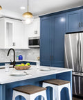 Modern kitchen with blue cabinets and stainless steel appliances, featuring matte black cabinet handles 5 inch overall length, 10 pack.