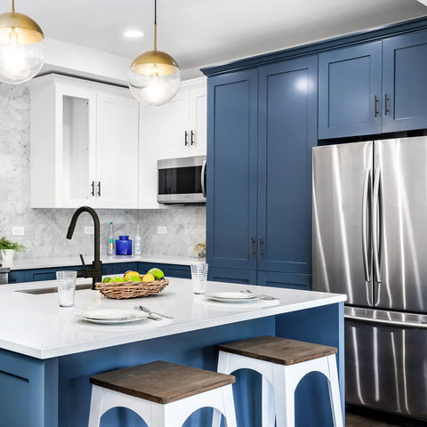 Modern kitchen with blue cabinets and stainless steel appliances, featuring matte black cabinet handles 5 inch overall length, 10 pack.