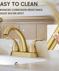 Brushed Gold 4 Inch Centerset Bathroom Faucet With Two Handles, Fits 2 Or 3 Hole Mount, Includes Copper Pop Up Drain And Water Supply Lines, Sturdy Brass Construction, BF008-5-BG shown being cleaned with a cloth on a white surface.