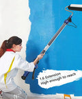 Game Changing Electric Paint Roller Brush With Long Extension Rod Auto Feed System For Effortless Wall And Ceiling Painting in use against blue wall.