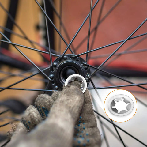 Close-up of a bicycle wheel assembly with Internal Tooth Star Lock Washers Kit Pack With 258 Pieces In 8 Sizes M2.5 To M12 304.