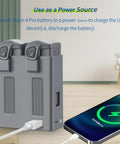 Two-Way USB Battery Hub For DJI Mavic 4 Pro With Smart Charging Station connected to smartphone on a desk