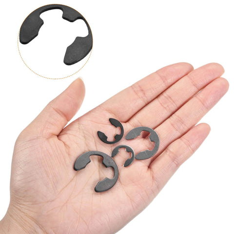 Person holding 50 Pack External Retaining Rings 5.25mm One Quarter Inch 65Mn Carbon Steel E Clip Circlip Snap Rings for mechanical projects