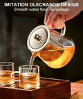 Pouring tea from a Stovetop Safe Glass Teapot 550ml with Removable Stainless Steel Infuser, borosilicate glass, into two cups.