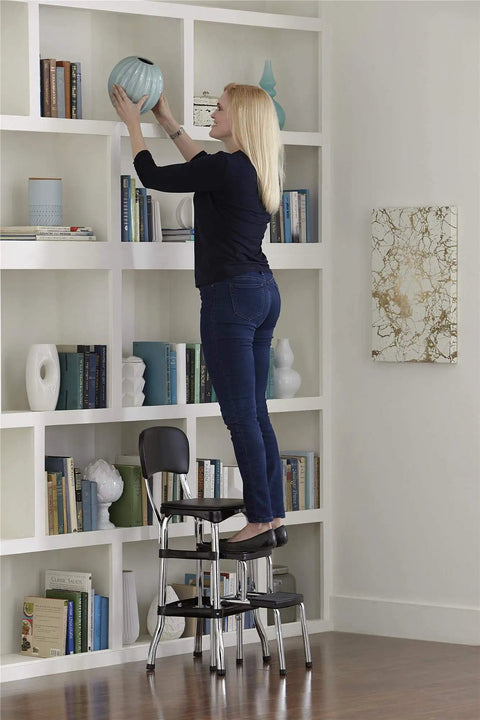 Woman using Retro Style Counter Height Chair With Pull Out Step Stool Cushioned Vinyl Seat And Back In Black And Chrome Finish