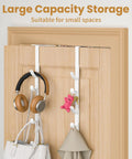 White metal over-the-door hooks on wooden door organizing headphones, bags, and accessories, ideal for bathroom closet use, two-pack