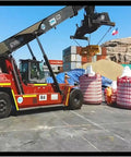 Forklift handling cargo with Heavy Duty Cargo Lifting Net 1.5x1.5m Flat Sling Hoisting Net Reusable 2.5t Load Capacity in a port