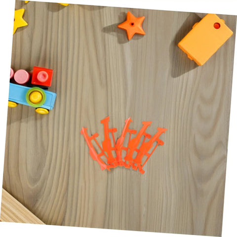 Five Pack Rubber Band Powered Glider Plane Kit For Kids And Fam bracket accessories on table, orange color visible