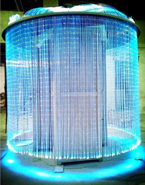 Dope PMMA Plastic Fiber Optic Strands 100 Piece Kit 0 04 Inch Diameter By 9 8 Feet Length Side Glow Wire creating a blue illuminated curtain.