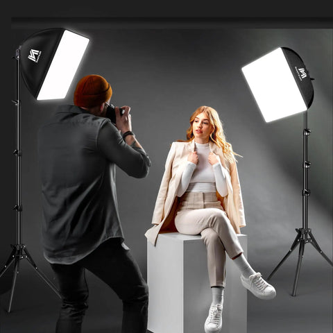 Photographer using Two Pack Softbox Lighting Kit with 16x16 panels, 63 inch tripod stand, 5400K daylight LED bulbs for studio shoot.