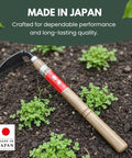 Hounen Miyawaki Japanese Weeding Sickle Twisted Stainless Kama Weeder with 4.7 Inch Blade and 13 Inch Wood Handle in garden soil