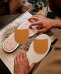 Grippy Shoe Heel Pads And Repair Patch Set For Sneakers And Boots Rubber Sole Protector being applied to shoe sole