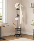 No Fuss Freestanding Coat Rack With 12 Hooks And Umbrella Holder Modern Metal Hall Tree For Entryway Living Room Bedroom Or Office Heavy Duty Standing Coat Hanger Stand In Black in a living room