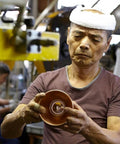 Artisan crafting a component for Tsubame WDS185 Stainless Steel Coffee Dripper, showcasing precision in Japanese manufacturing.
