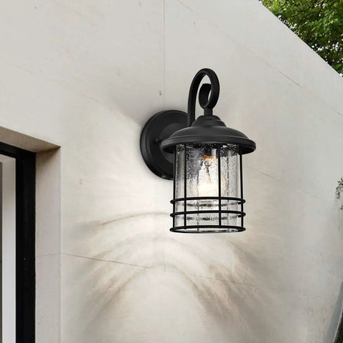 Slim 5.5 Inch Wide Outdoor Wall Light 2 Pack in Textured Black with Seedy Glass on side wall near door, rust resistant lantern.