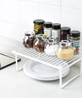 Stackable Metal Wire Racks For Kitchen Cabinets And Pantries Beat The Kitchen Chaos Easy Storage Solutions Heavy Duty Steel Organizer Shelves Set Of Two Straight Up Durable Countertop Setup White Finish with jars and spices.