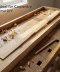 Foldable Wood Ruler 6 Ft 6 In With US And Metric Measurements on a workbench with pencil and wood shavings, ideal for carpentry.