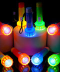 30 Piece Mini Flashlight Set With Lanyards Batteries Included Bright Colorful Handheld Torches lit up in a dark setting.