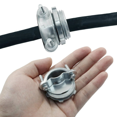 Heavy Duty 1 Inch Clamp Cable Connectors 4 Pack Including Free Screwdriver showing zinc clamps in hand with cable attached.