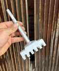 Hand holding Square Hole Cutter Kit For 86-Type Electrical Junction Boxes against wall, tools for concrete wall punch.