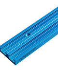 36 Inch Universal T Track With Double Cut Profile And Pre Drilled Mount Points For Zero Fuss Setup On Workbenches Table Saws And Drill Presses Featuring Rock Tight Grip And Laser Etched Measurements, blue aluminum rail with measurements.