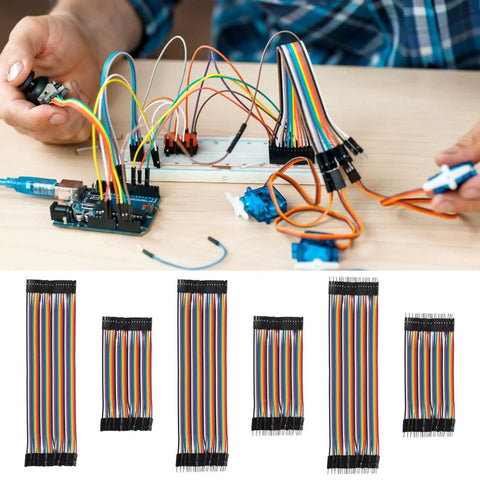 Hands using Dope Multicolor Breadboard Jumper Wire Kit 240Pcs with 10Cm and 20Cm cables for prototyping; wires in 10 colors