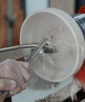 Top Notch M2 High Speed Steel Cryogenically Treated Bowl Gouge For Woodturning in use, shaping a bowl on a lathe.