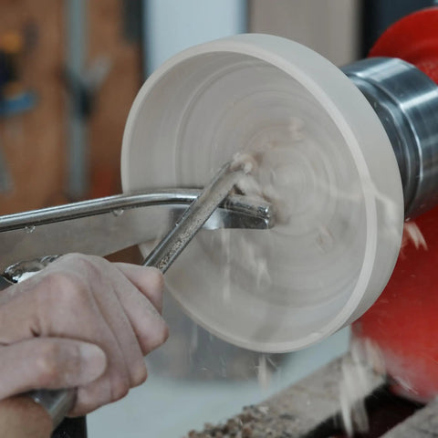 Top Notch M2 High Speed Steel Cryogenically Treated Bowl Gouge For Woodturning in use, shaping a bowl on a lathe.