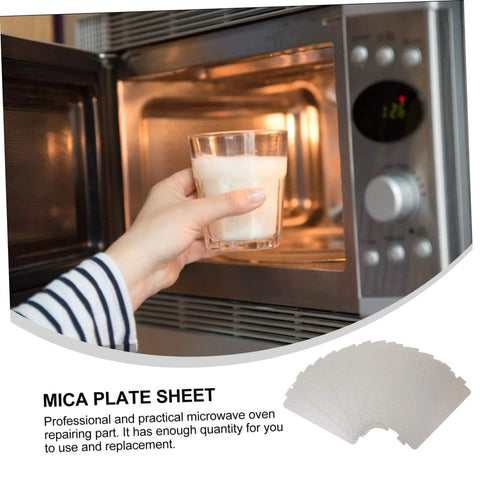 Person using a microwave with 12 Pack Microwave Mica Sheet Waveguide Cover Replacement Plate Heat Resistant Insulation Easy To Cut.