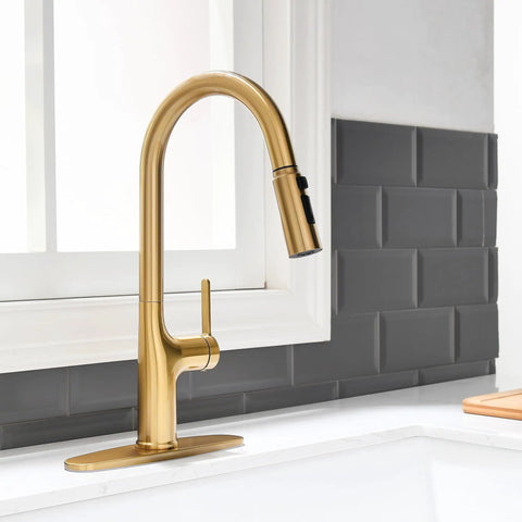 Smooth Operator Brushed Gold Kitchen Faucet With Sleek Single Handle And Slick Pull Down Sprayer For Zero Hassle Cleaning Featuring Splash Proof Three Way Spray For Quick One Or Three Hole Install shown from a side angle with gooseneck spout.