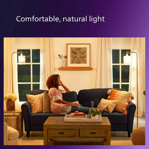Room with 3 Pack LED Candelabra Bulbs E12 Dimmable Soft White 2700K 60W Equiv lighting, woman on couch.